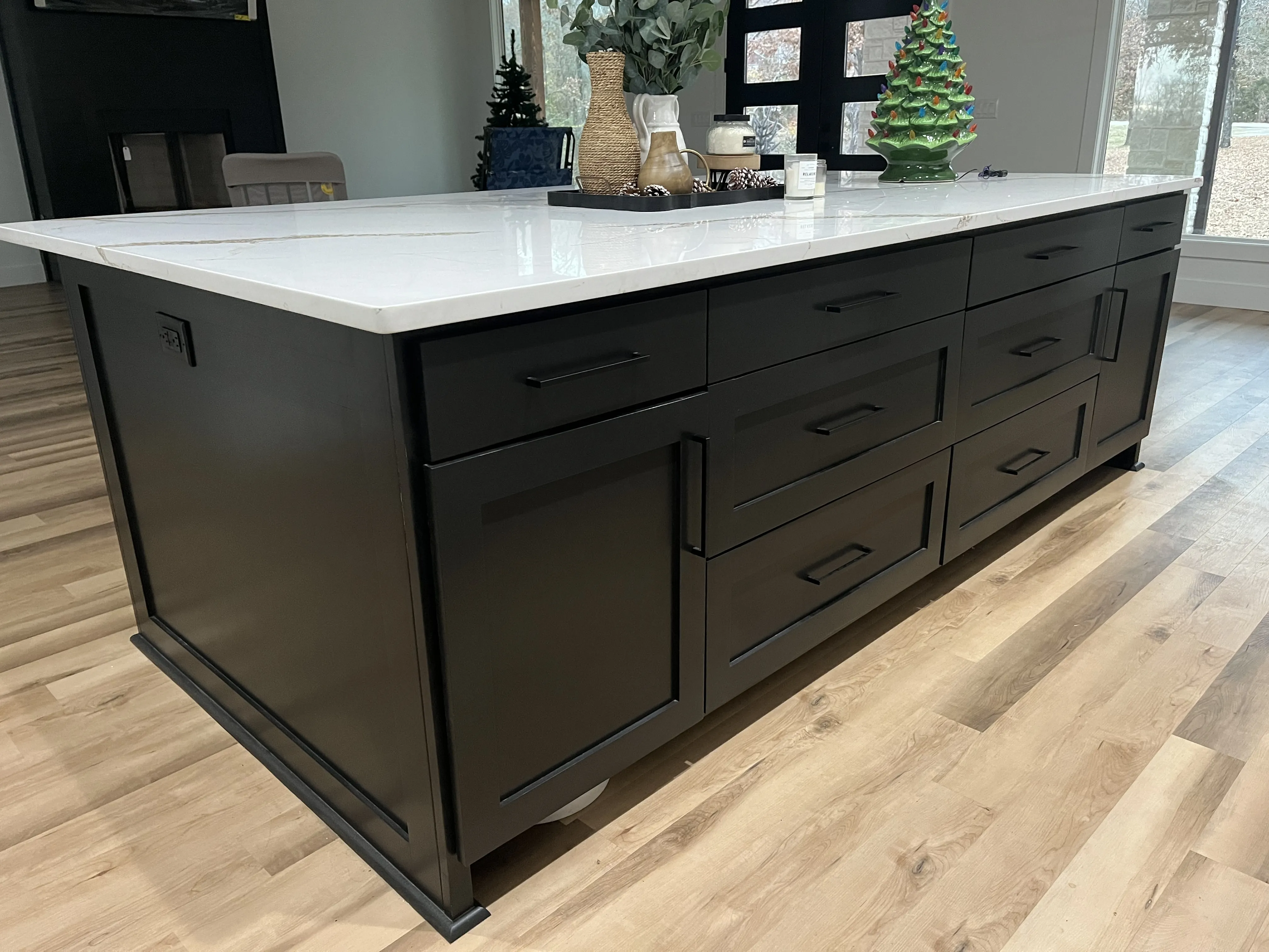 Matte black shaker island with calacatta quartz