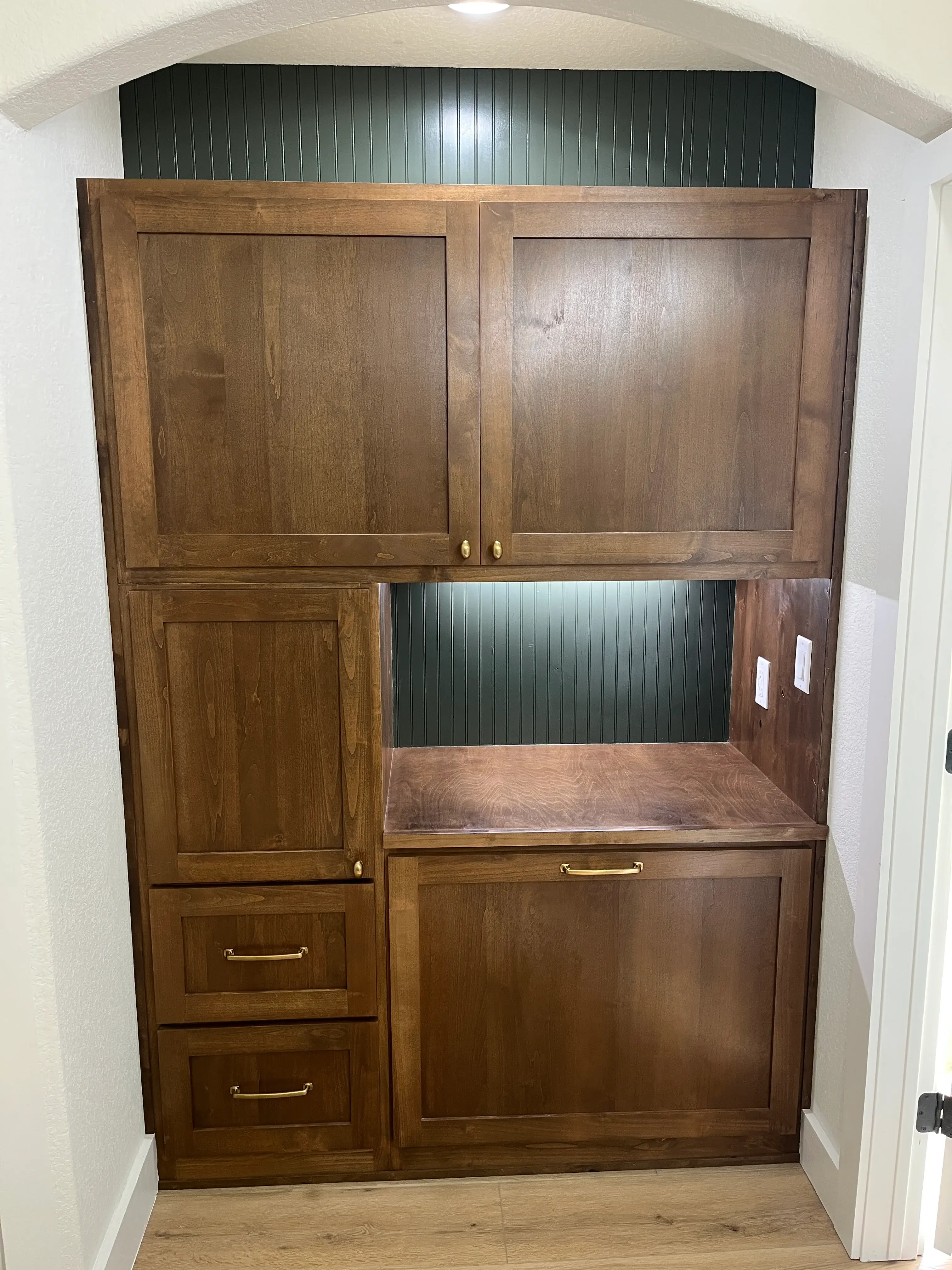 Walnut butler pantry nook with beadboard and arched alcove